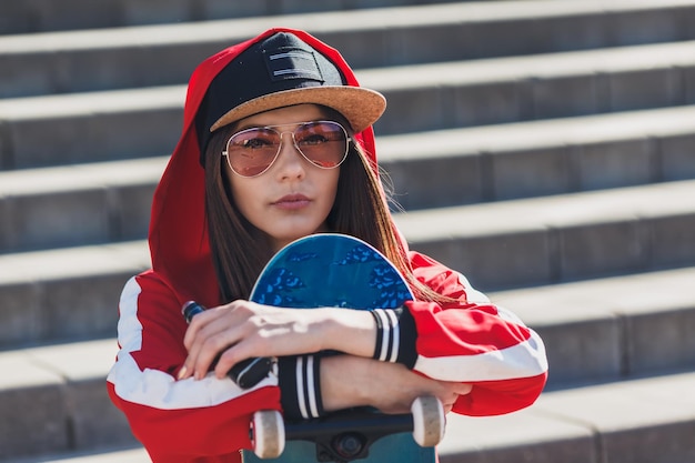 Vaping girl young woman with skateboard vape ecig