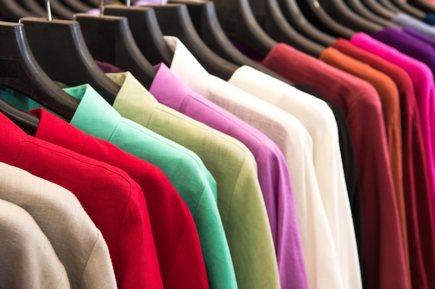 Variation multicolour shirt hanging on rack at the market