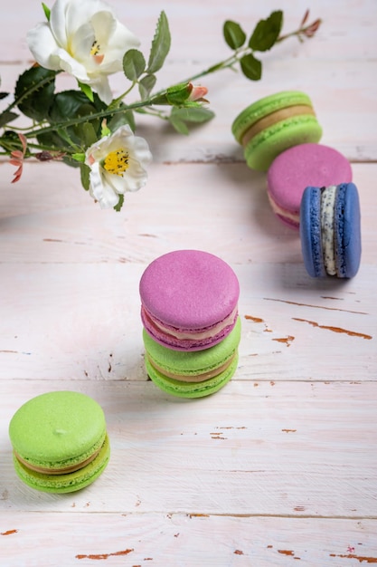 A variety of almond French macaroon biscuits on a light wooden table