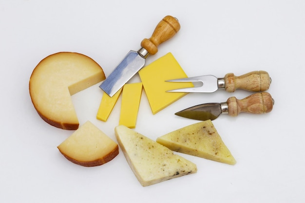 A variety of cheeses and cheeses are on a white background.