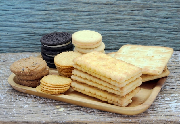 Variety of chocolate chip cookies on wooden table