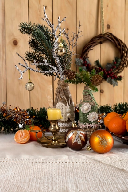 A variety of Christmas tree ornaments oranges and tangerines on the table closeup