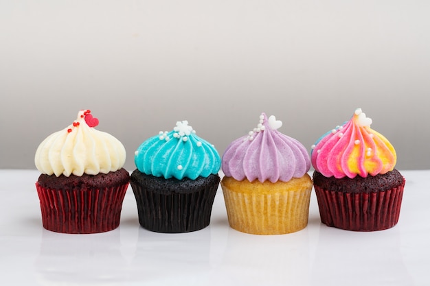 Variety colorful cute cupcake on white background