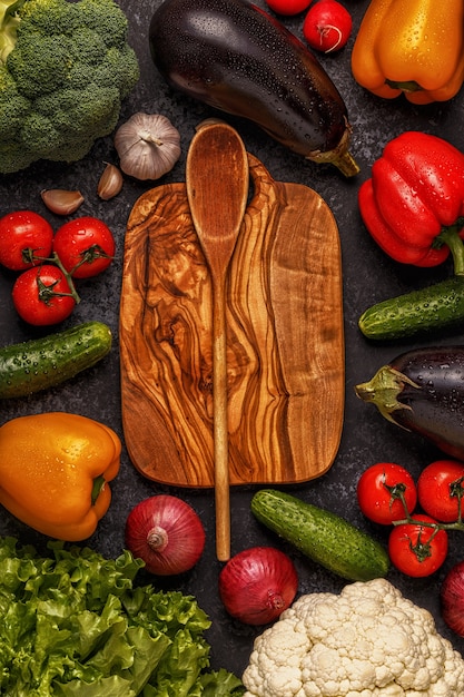 Variety of fresh vegetables on the dark table