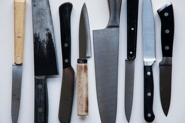 A variety of knives on a plain background Knife crime concept