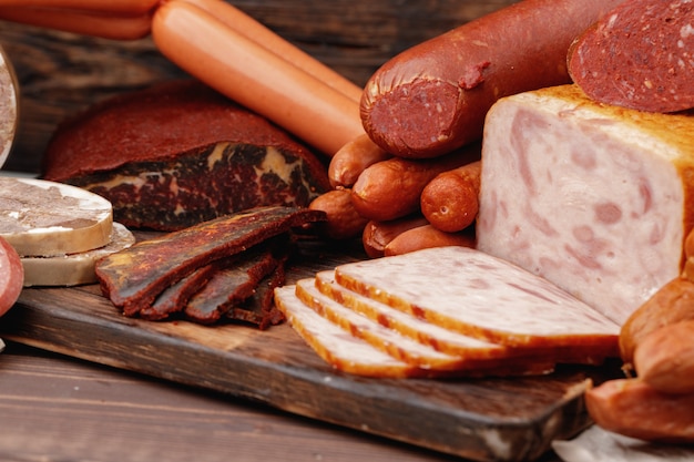 Variety of meat and sausage products on table