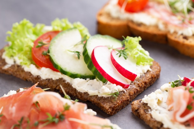 Variety of mini sandwiches with cream cheese