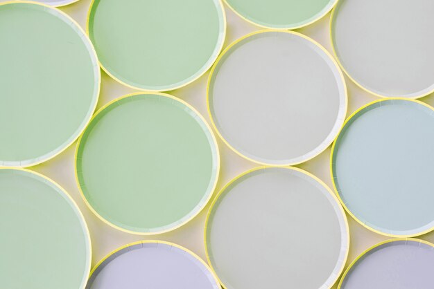 A variety of paper disposable plates of different colors