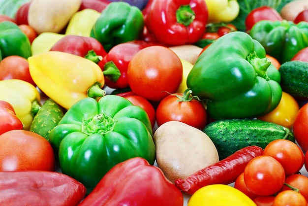 Variety of raw red and green vegetables.