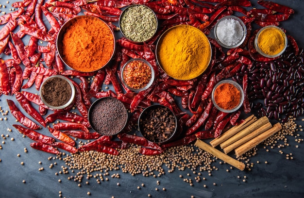 Variety of spices and herbs on kitchen table