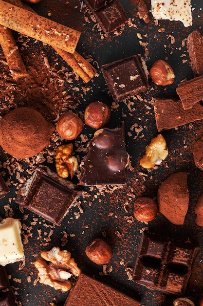 Variety of sweet homemade chocolate pralines on wooden background