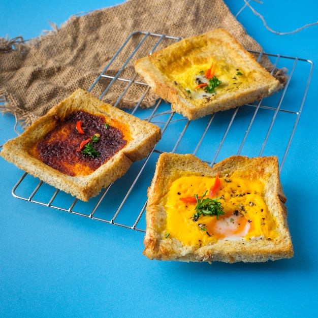 Variety of toast bread with tasty toppings.