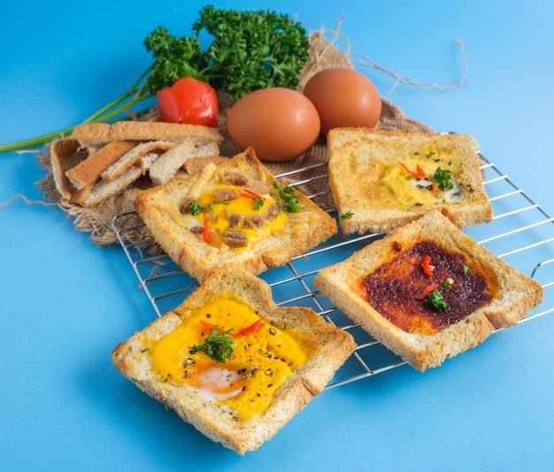 Variety of toast bread with tasty toppings.