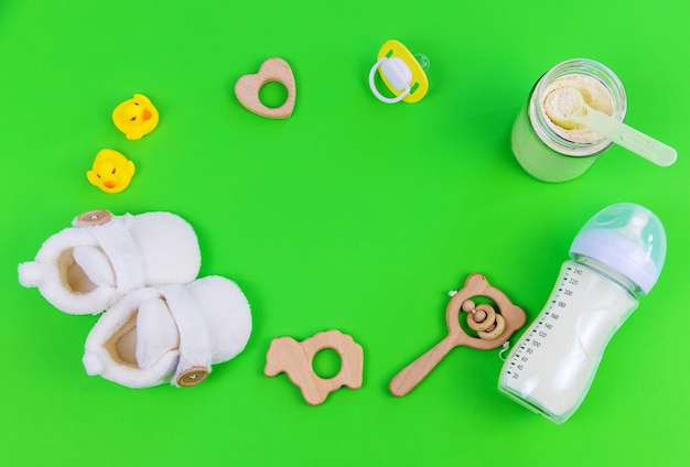 Various accessories for babies. green background. selective focus.