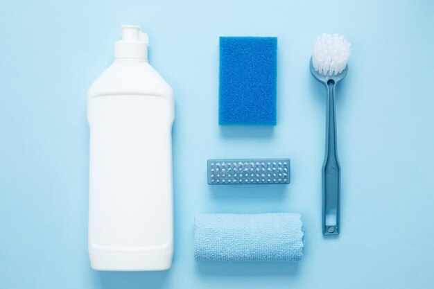 Various accessories cleaning products sprays rags sponges and brushes Top view flat lay copy space