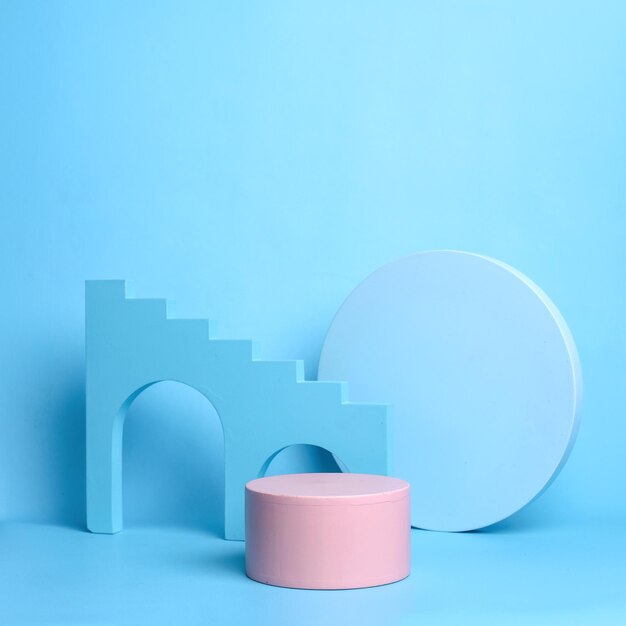 Various blue geometric forms on pastel blue background. Exhibition and presentation beauty products.