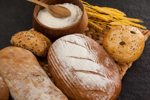 Various bread loaves with flour