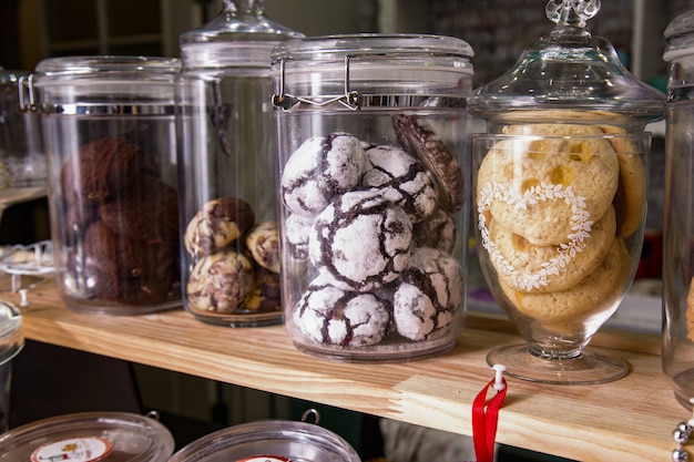 Various cakes and biscuits in a cafe on the counter