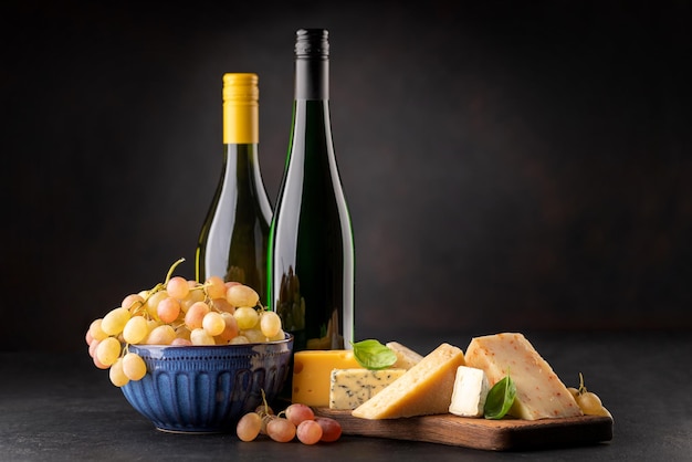 Various cheese on board and white wine