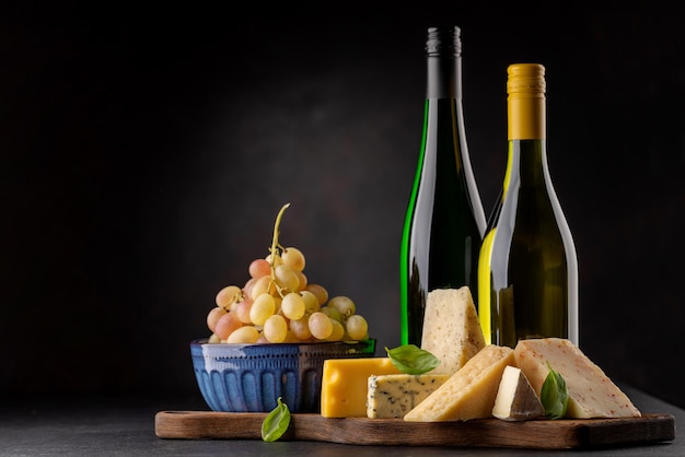 Various cheese on board and white wine