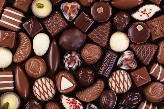 Various chocolate candy and pralines sweet food background