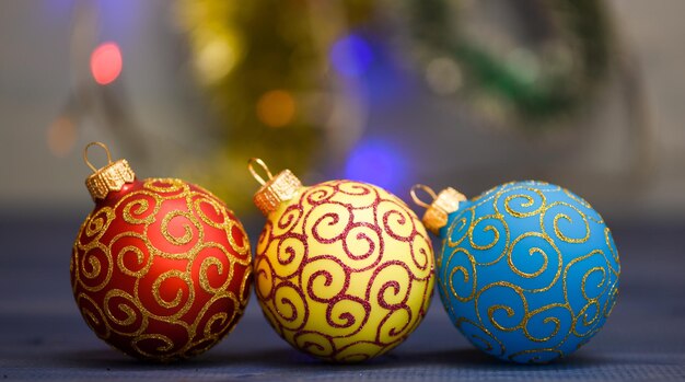 Various christmas decorations. Christmas balls decoration on blue wooden surface. Winter holiday concept. Decorate christmas tree with traditional toys. Symbol of new year and christmas holidays.