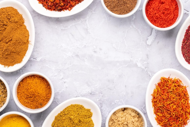 Various dried spices in small bowls