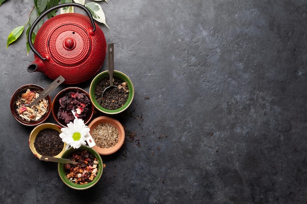 Various dried tea and teapot