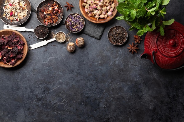 Various dried tea and teapot