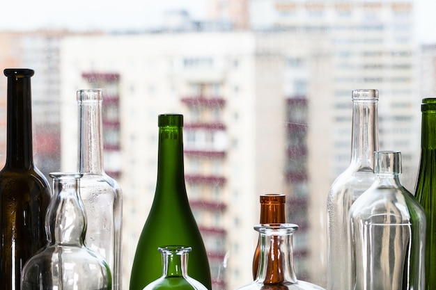 Various empty bottles and view of apartment houses