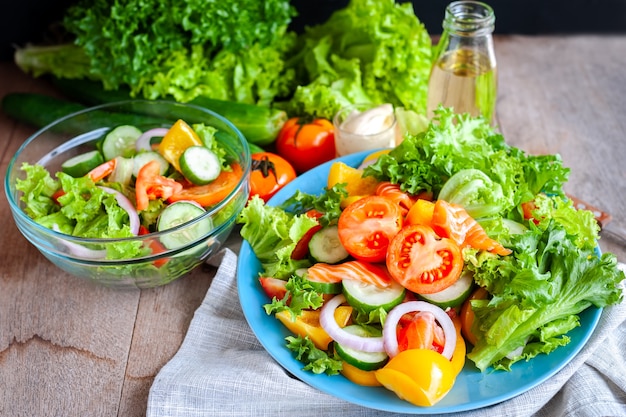 Various fresh mix salad with tomato, cucumber, onion, bell pepper, healthy food and diet m