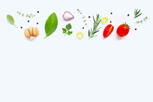 Various fresh vegetables and herbs on white background. Healthy eating concept