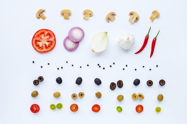 Various fresh vegetables and herbs on white background. 