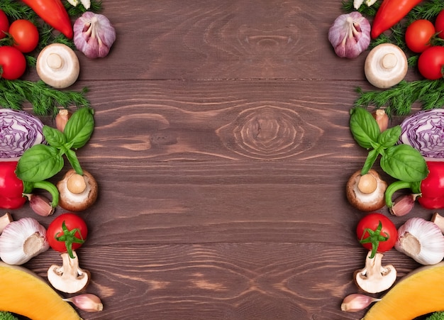 Various fresh vegetables ingredients for salad on wooden