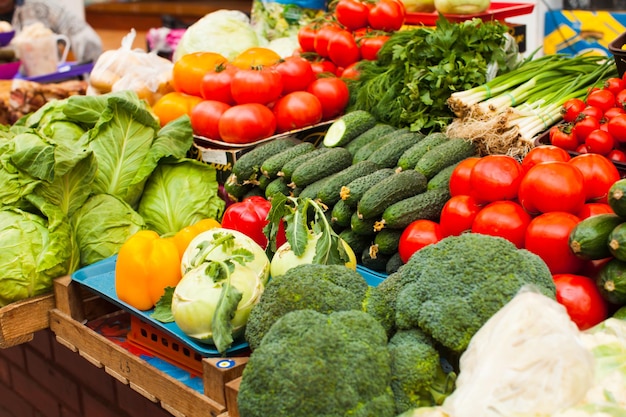 Various fresh vegetables on the outdoor market close up