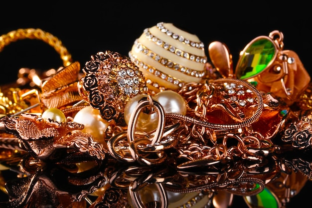 Various gold jewellery on black