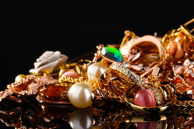 Various gold jewellery on black