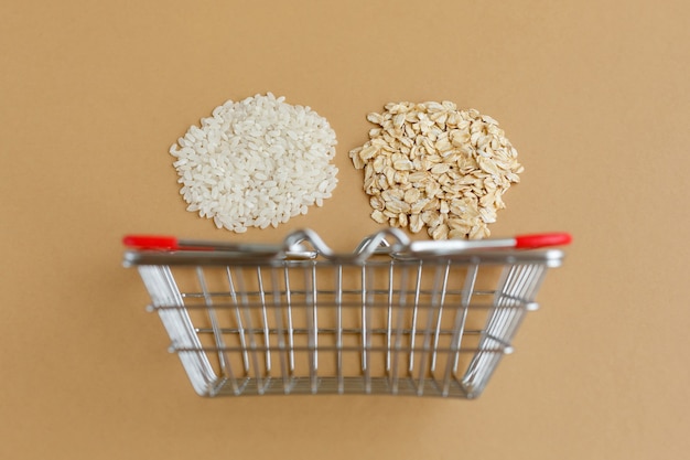 Various groats in a grocery basket on a brown background