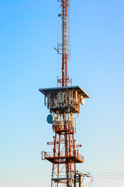 Various GSM antennas against the blue sky