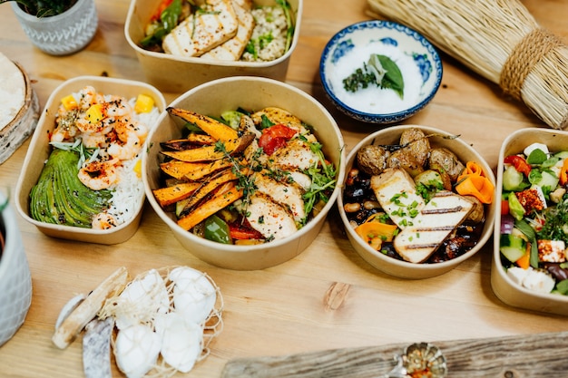 various healthy and vitamin rich dishes and food in an ecobox delivered by a delivery service