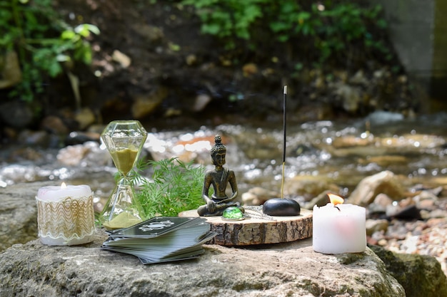 Various items for ritual and fortunetelling on the background of a mountain river