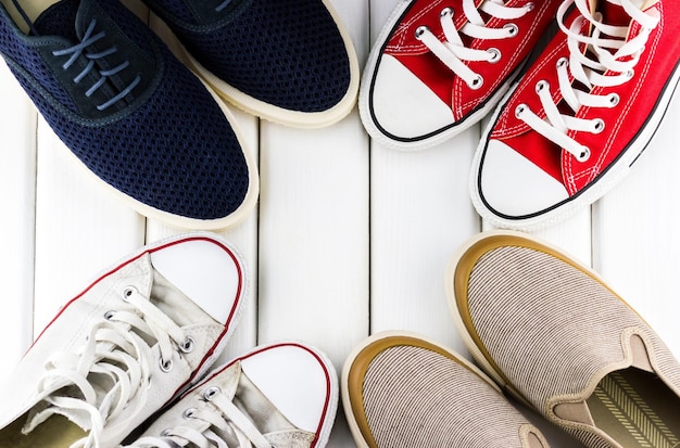 Various men's shoes stand in a circle