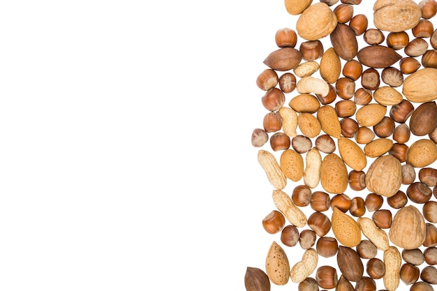 Various nuts arrenged in a pile with copy space banner or header shape