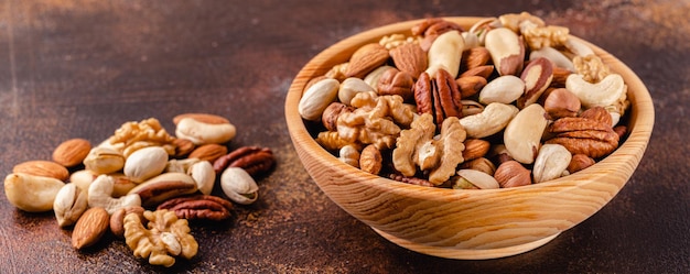 Various Nuts in wooden bowl