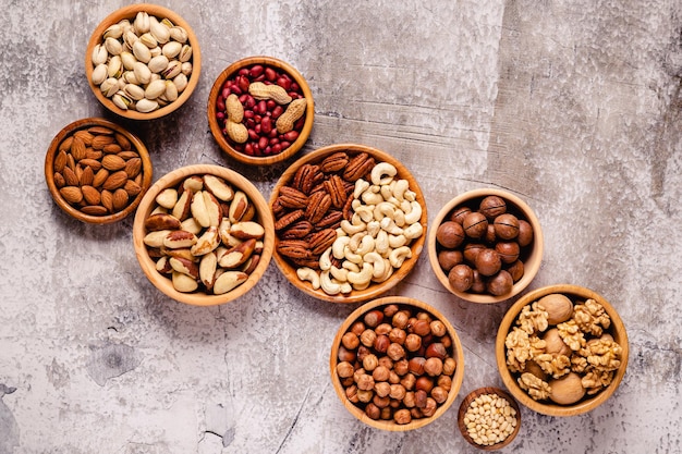 Various Nuts in wooden bowls