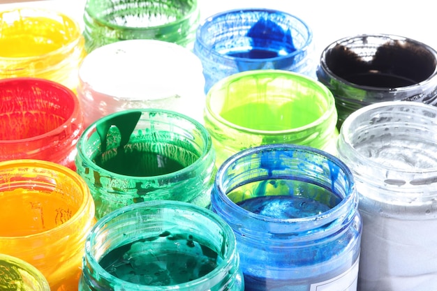 Various paints in glass bottle