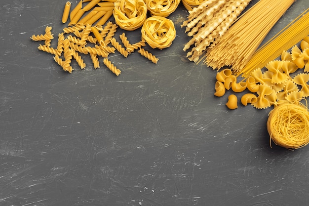 Various pasta top view background. Cooking concept