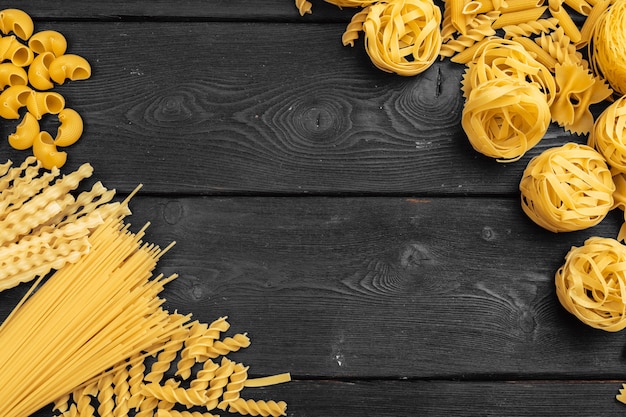 Various pasta on wood