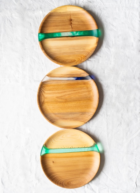 Various round wooden craft trays with resin inserts