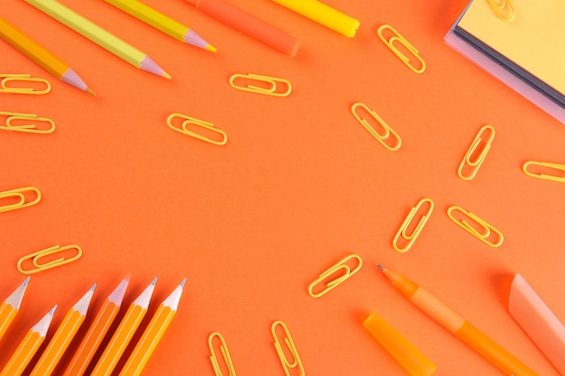 Various school supplies on a colored background